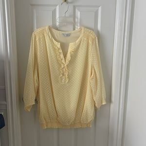 A yellow clip dot blouse